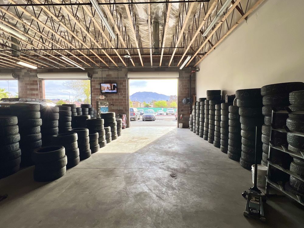 Shop bays with tires stacked on both sides
