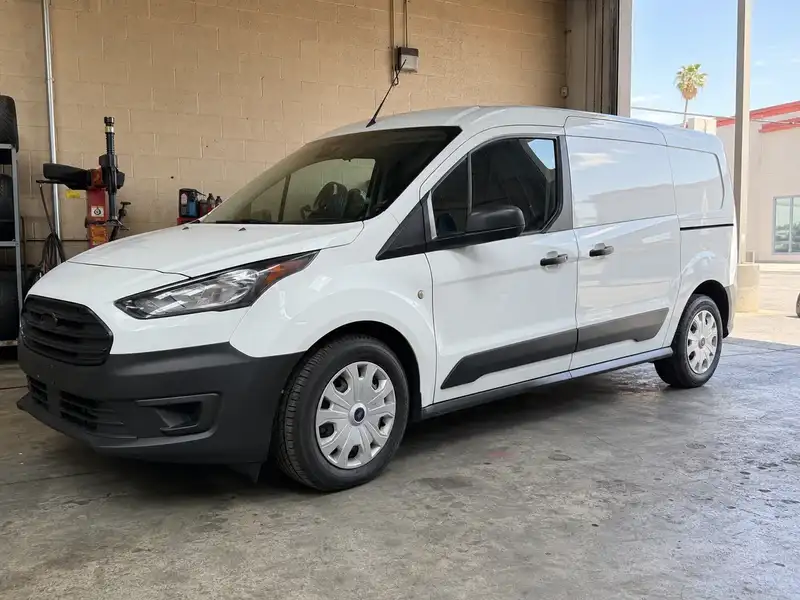 White work van with new commercial tires