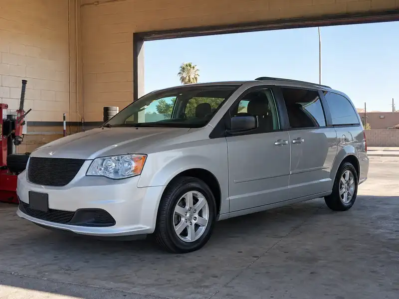 Silver family minivan with new tires
