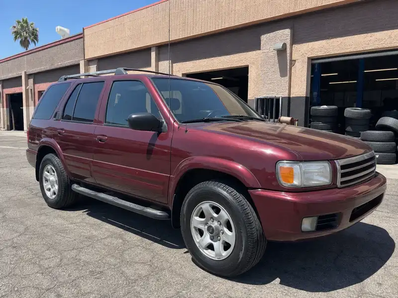 Burgundy SUV with new tires