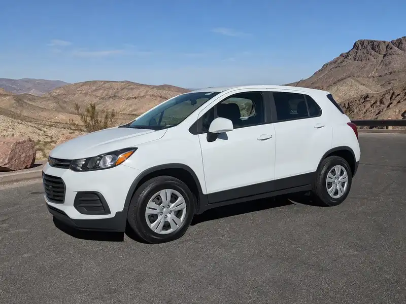 White crossover with new tires on a desert road
