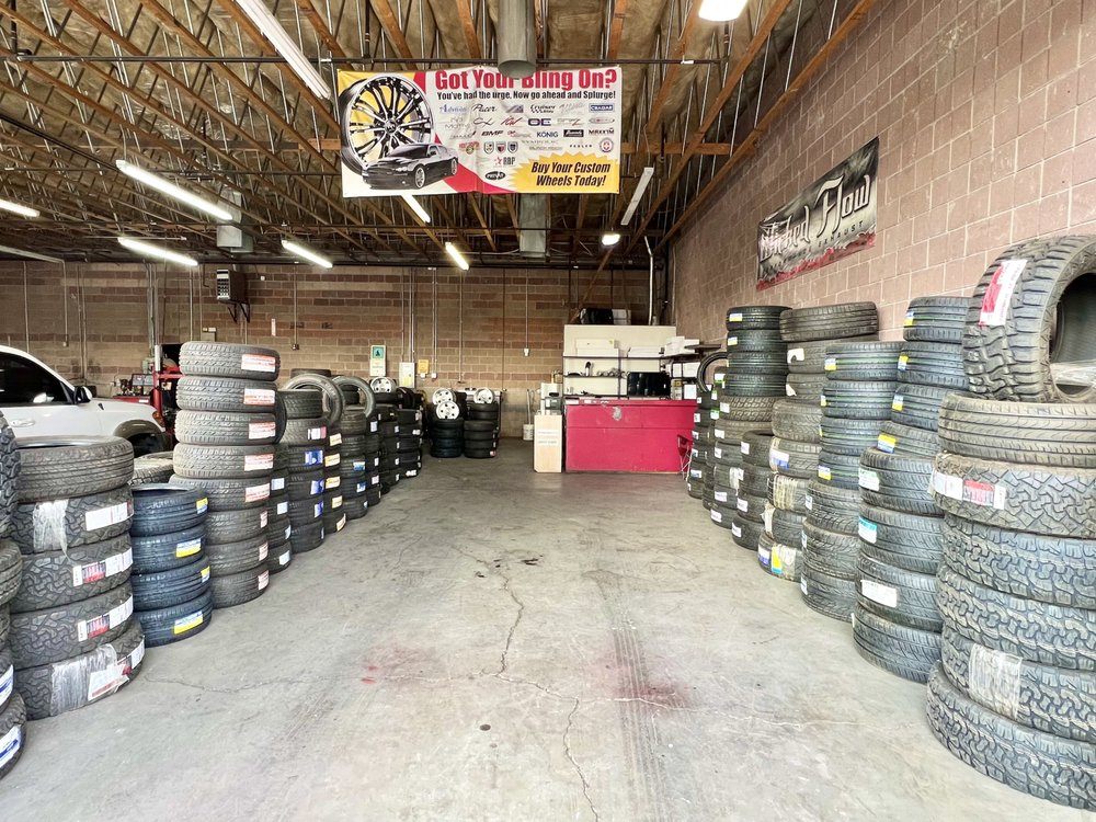 New and used tire inventory next to the counter