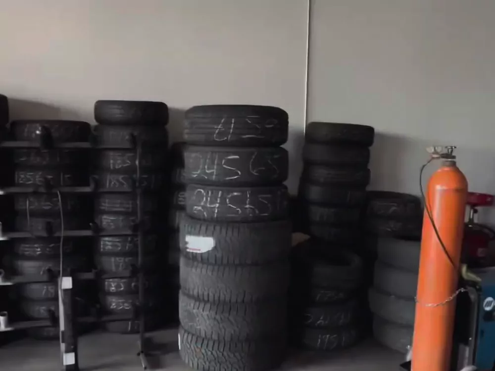 Kain's Tires used-tire wall with the size written on each sidewall
